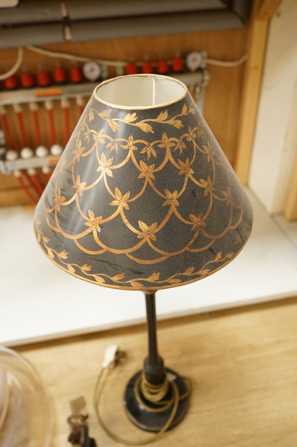 A large 1970's amber and opaque glass ceiling shade, 32cm high, Kandem model 802 adjustable lamp with clamp, 94cm high (fully extended) and a table lamp with toleware shade